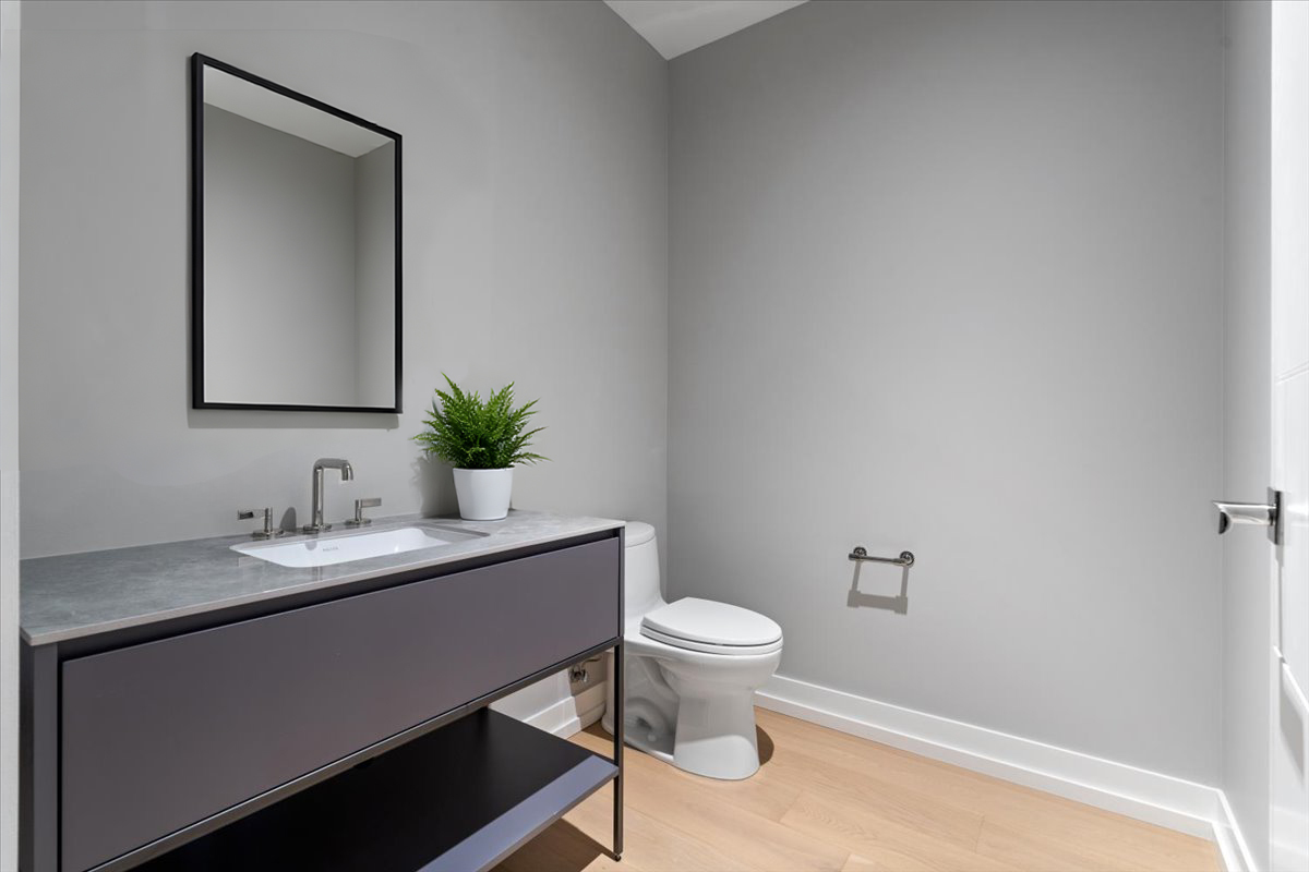 14 West Superior Street, Unit 6002 Chicago, IL 60654 - Photo 14 of 44 a bathroom with a sink toilet and mirror