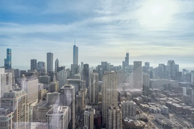 a living room with furniture a rug and a flat screen tv