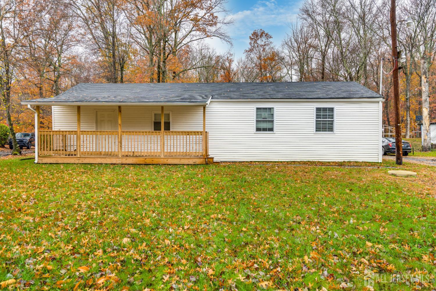 113 Fresh Ponds Road Monroe Township, NJ 08831 - Photo 1 of 18 a house view with a garden space