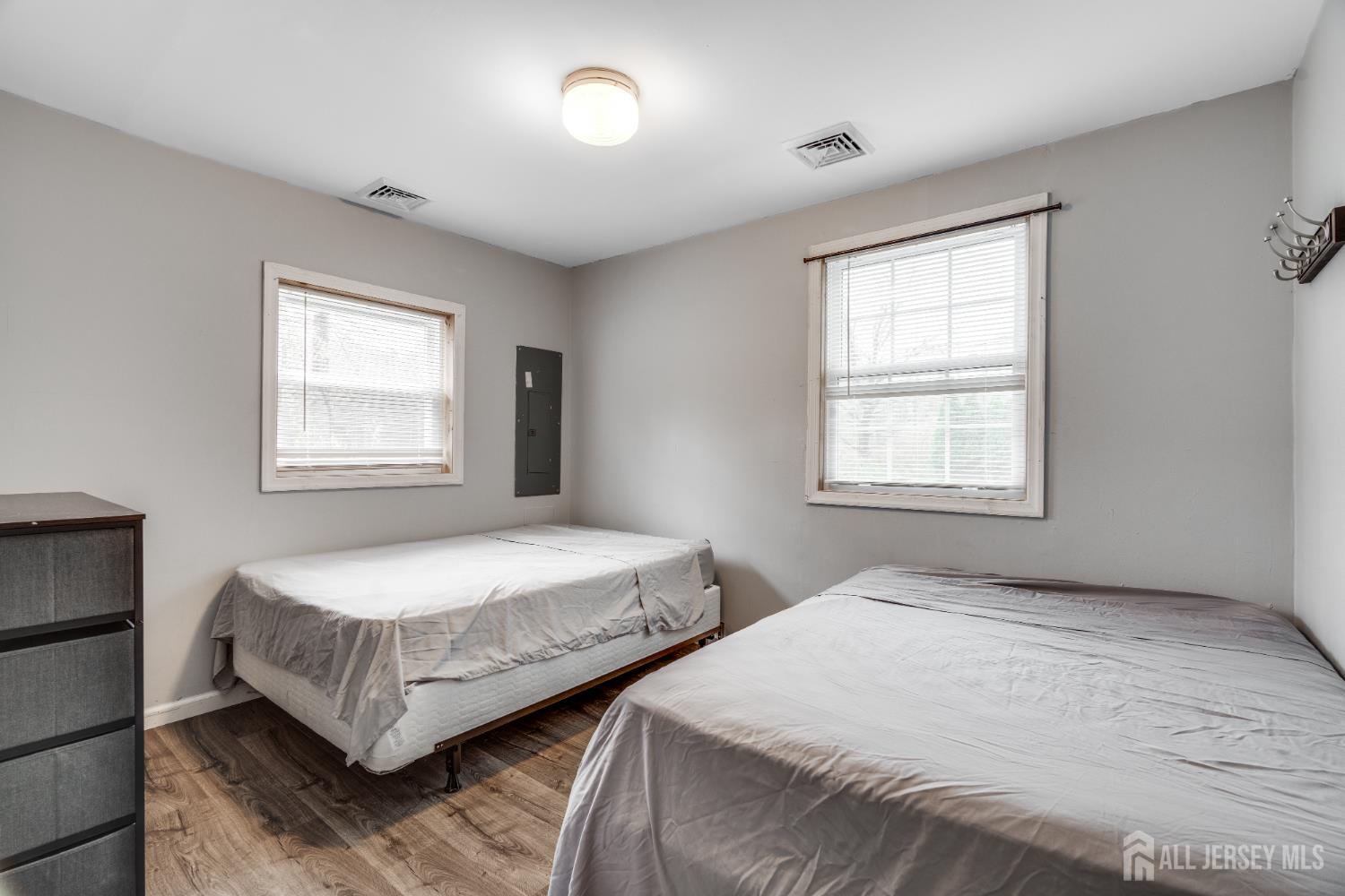 113 Fresh Ponds Road Monroe Township, NJ 08831 - Photo 12 of 18 a bedroom with two beds and a window