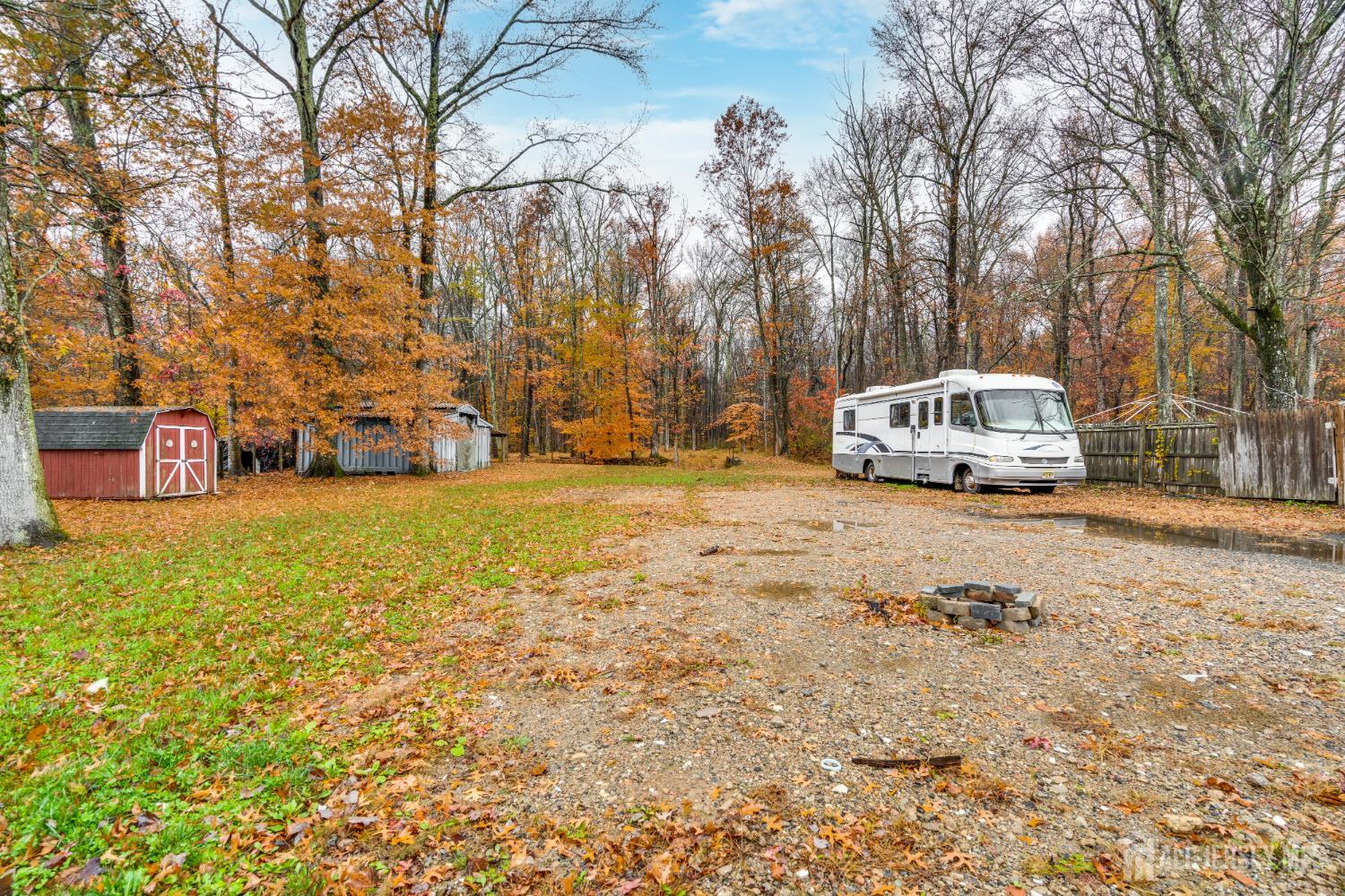 113 Fresh Ponds Road Monroe Township, NJ 08831 - Photo 15 of 18 a view of a car park in front of a house