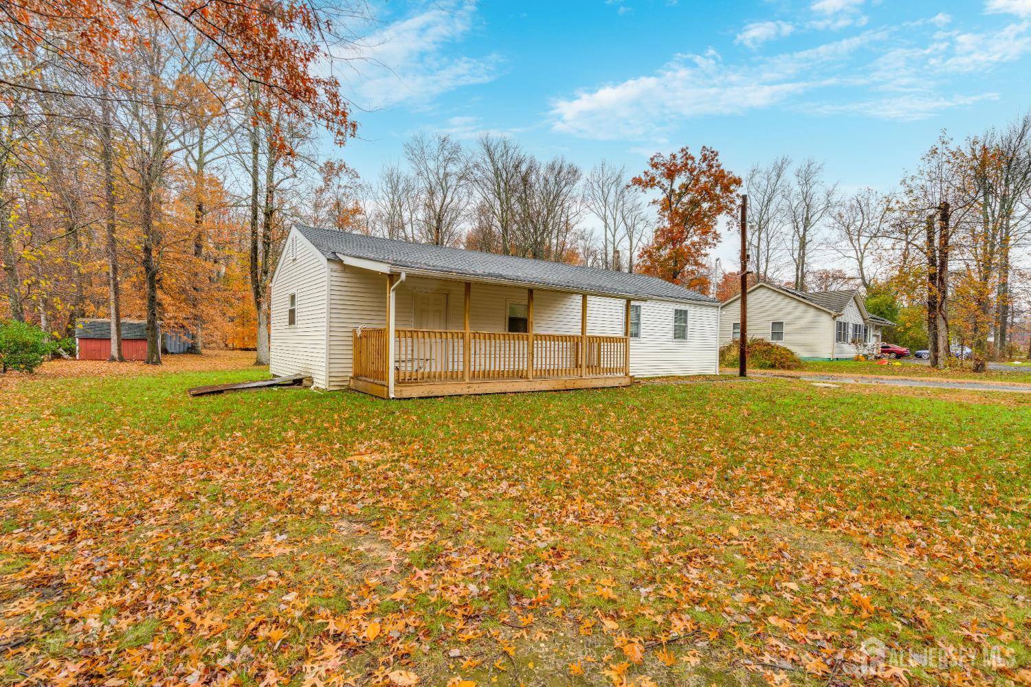 113 Fresh Ponds Road Monroe Township, NJ 08831 - Photo 2 of 18 a view of a house with backyard and trees