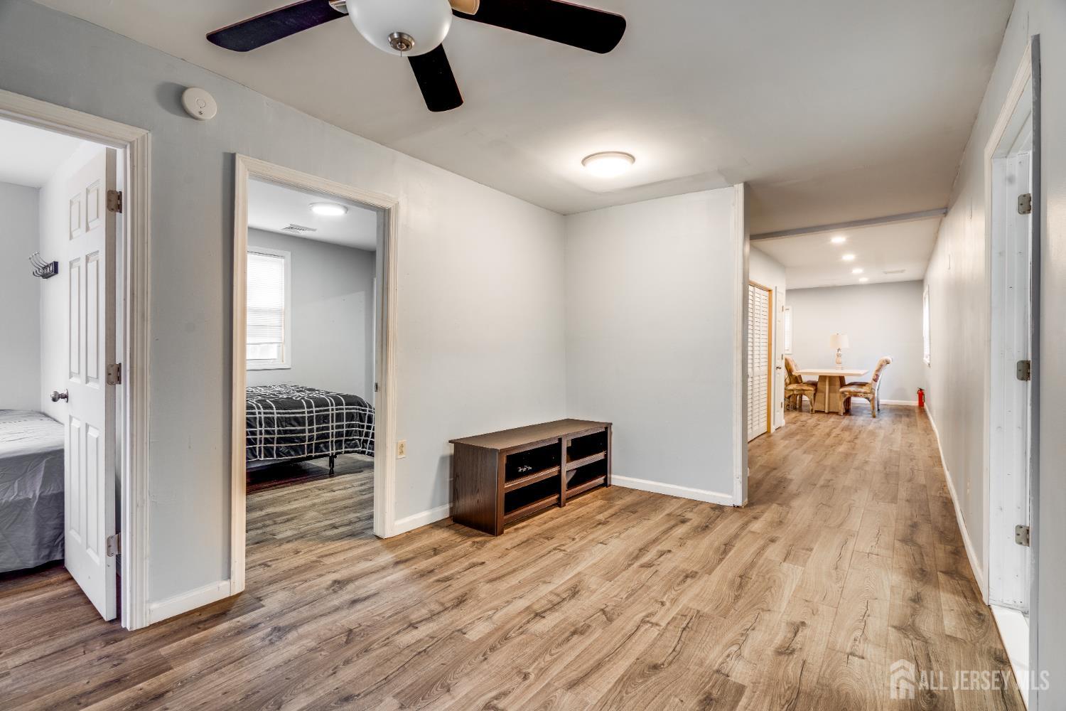 113 Fresh Ponds Road Monroe Township, NJ 08831 - Photo 7 of 18 a view of a livingroom with wooden floor