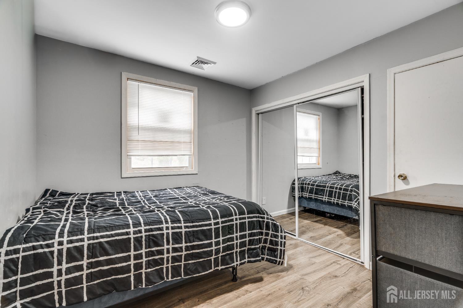 113 Fresh Ponds Road Monroe Township, NJ 08831 - Photo 8 of 18 a bedroom with bed and window