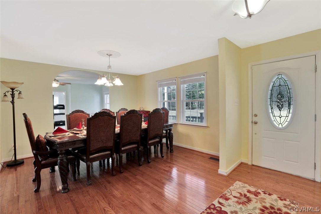 21003 Skinquarter Road Moseley, VA 23120 - Photo 2 of 22 a very nice looking dining room with furniture and wooden floor