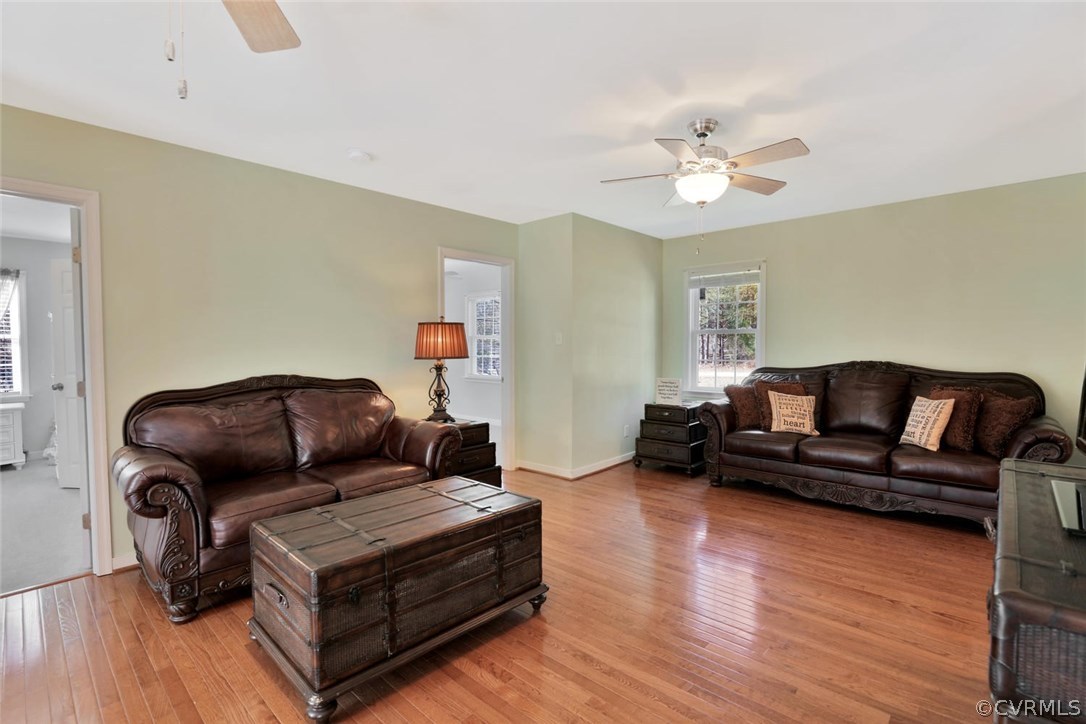 21003 Skinquarter Road Moseley, VA 23120 - Photo 8 of 22 a living room with furniture and wooden floor