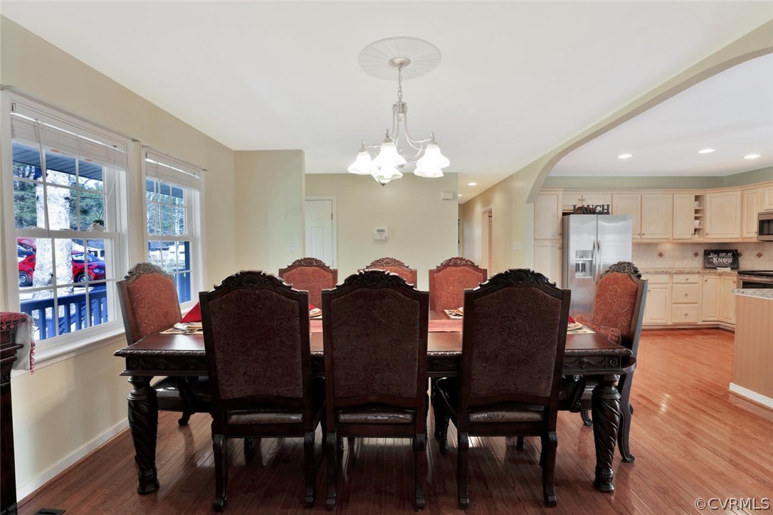 21003 Skinquarter Road Moseley, VA 23120 - Photo 10 of 22 a view of a dining room with furniture and wooden floor