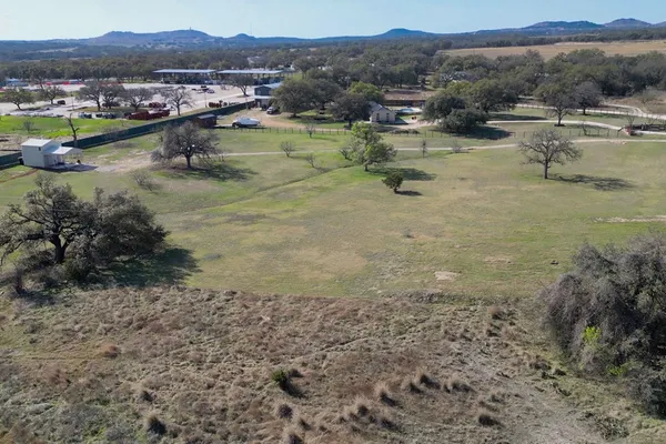 a view of a town with mountains in the background