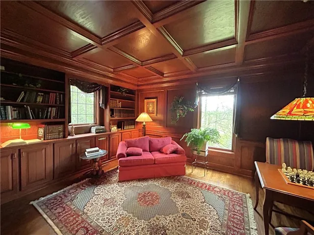 a living room with furniture a window and a table