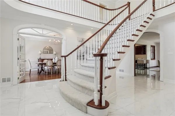 a view of entryway and hall with dining room