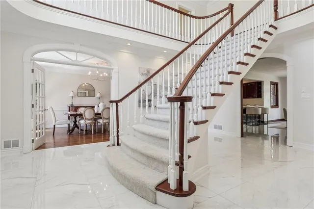 a view of entryway and hall with dining room