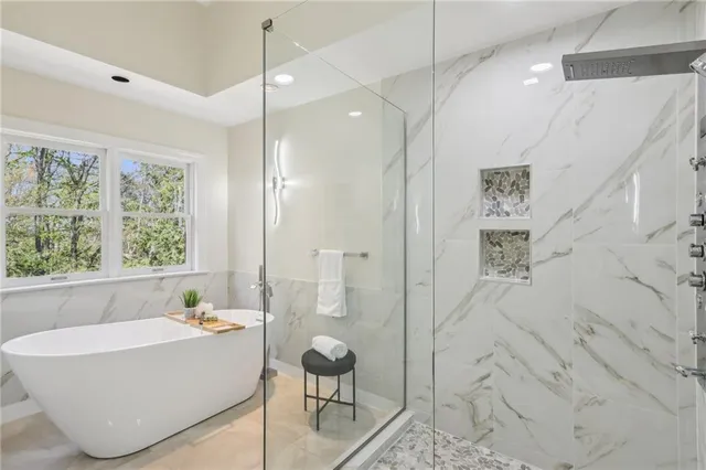 a bathroom with a bathtub and shower