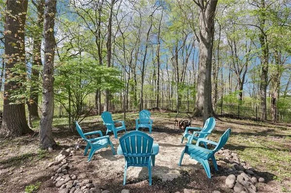 a backyard of a house with outdoor seating