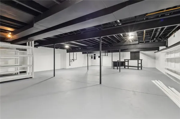 a view of empty room with wooden ceiling