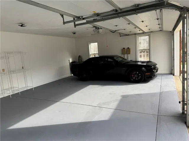 a black car parked in a garage