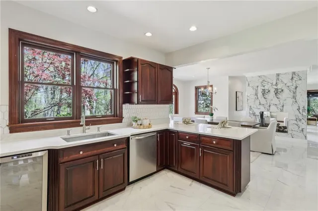 a kitchen with a sink stove and cabinets