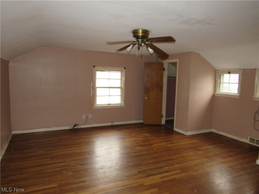 2350 North Taylor Road Cleveland, OH 44112 - Photo 15 of 24 Additional living space with dark hardwood / wood-style floors, ceiling fan, and vaulted ceiling