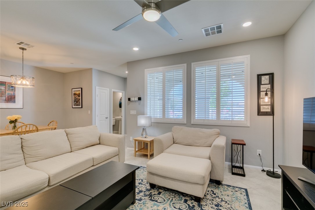 2870 Turnstone Ridge Street Henderson, NV 89044 - Photo 10 of 50 Living area with a ceiling fan, a chandelier, recessed lighting, and baseboards