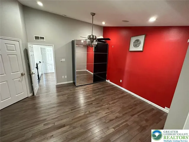 a en suite bathroom with a tub and a large mirror