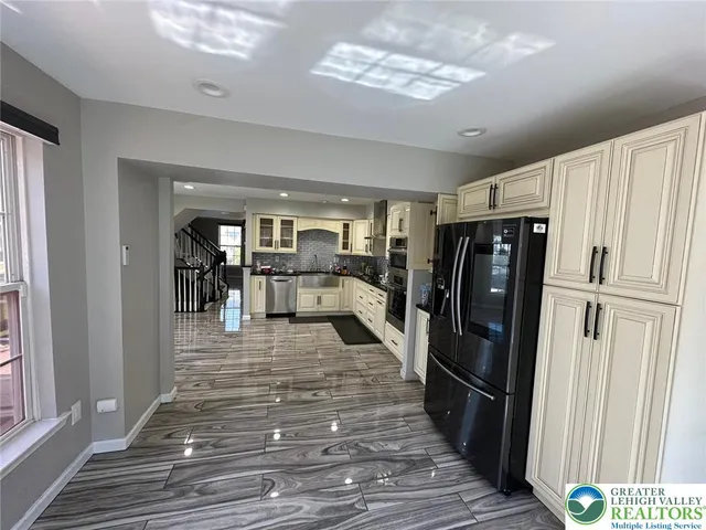a view of an entryway with wooden floor