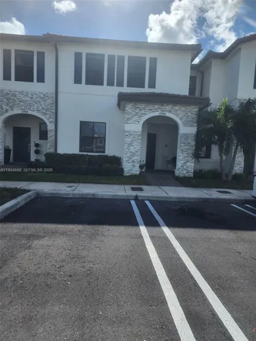 a front view of a house with yard