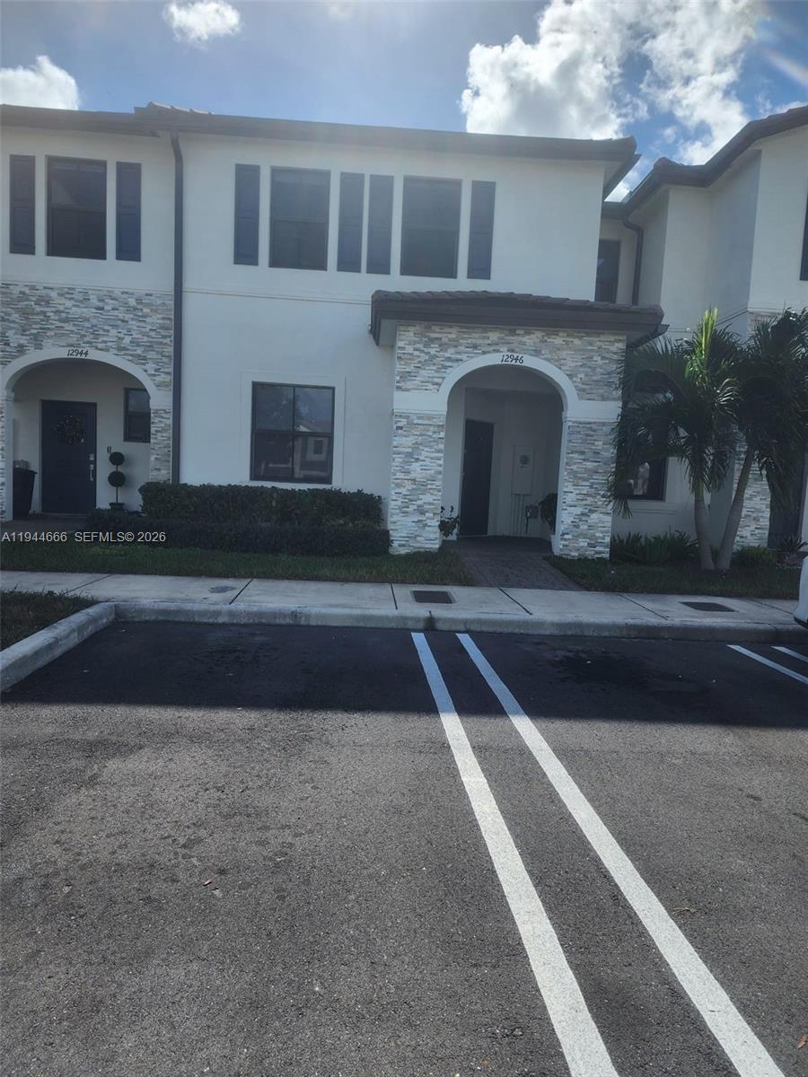 a front view of a house with yard