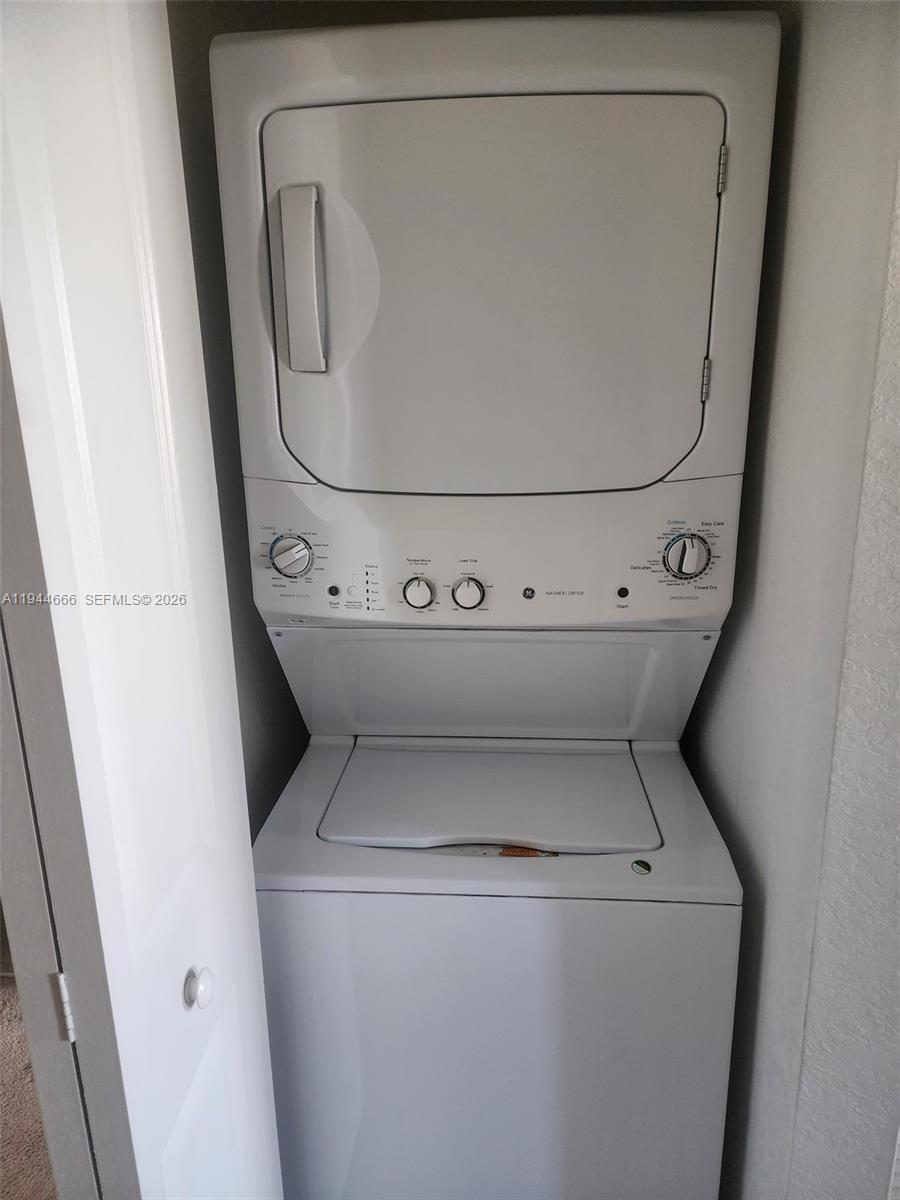 12946 Southwest 232nd Terrace, Unit 12946 Homestead, FL 33032 - Photo 11 of 11 a utility room with dryer and washer