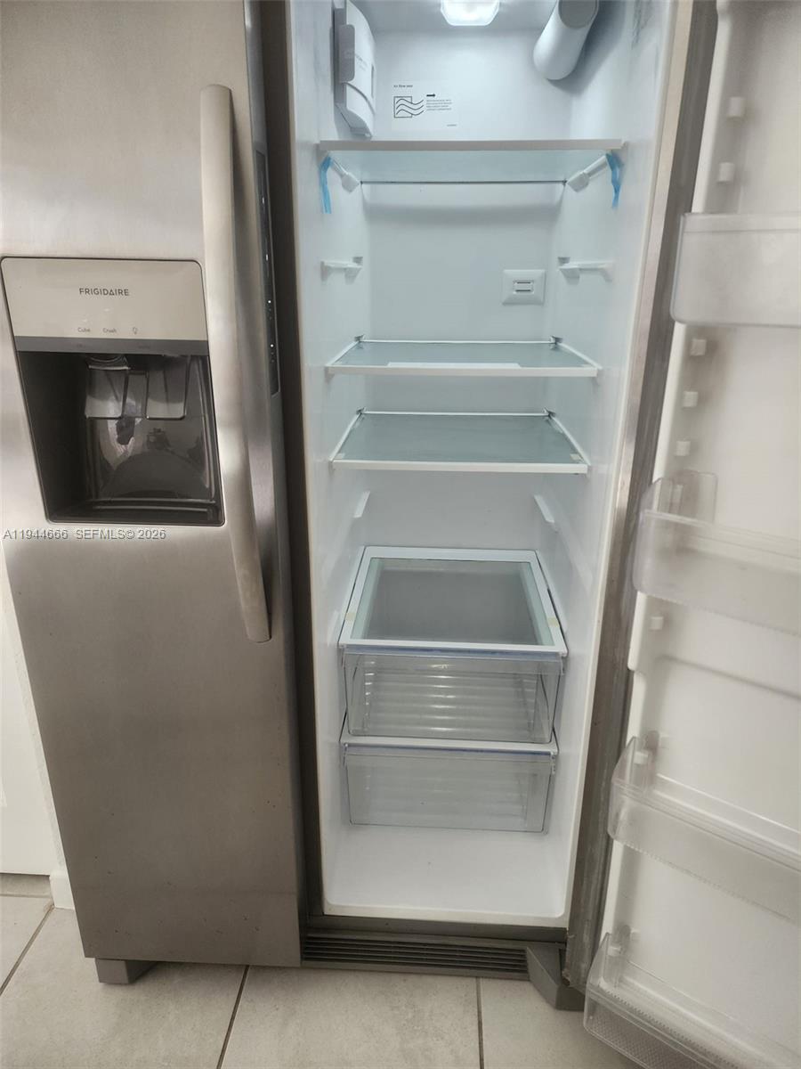 12946 Southwest 232nd Terrace, Unit 12946 Homestead, FL 33032 - Photo 4 of 11 a view of storage and utility room