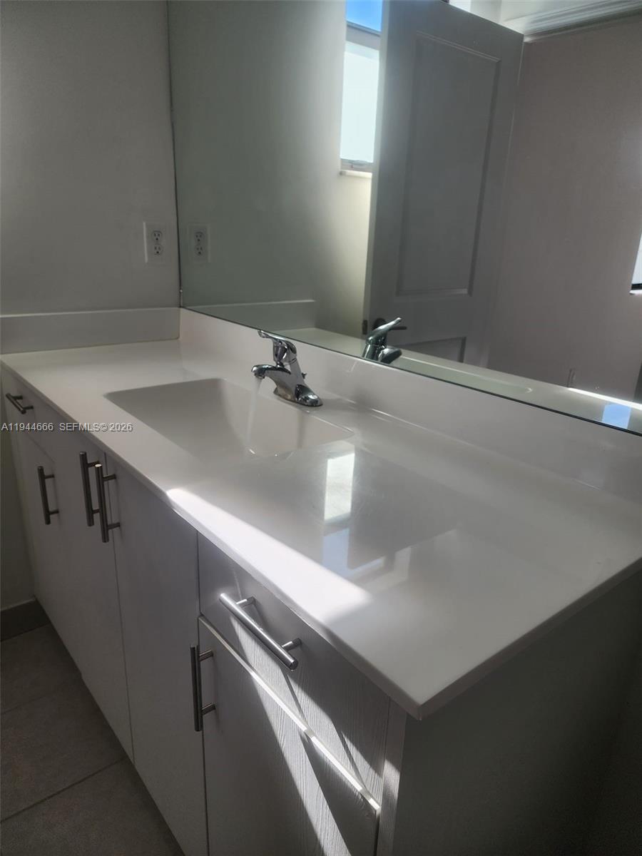 12946 Southwest 232nd Terrace, Unit 12946 Homestead, FL 33032 - Photo 8 of 11 a close view of sink and tap