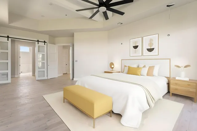 a bedroom with a bed and window