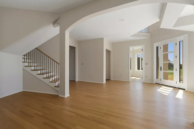 a view of an entryway with wooden floor