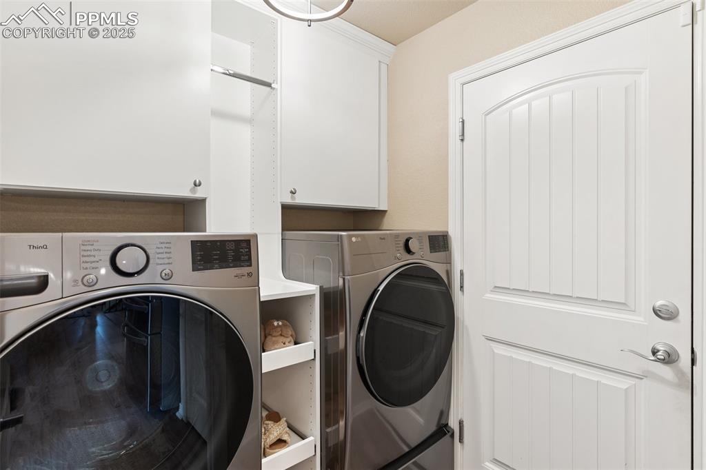 977 Salmon Pond Way Colorado Springs, CO 80921 - Photo 31 of 49 a utility room with dryer and washer