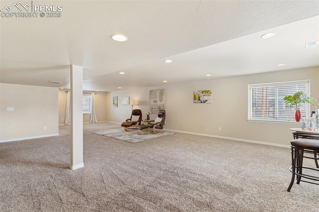 977 Salmon Pond Way Colorado Springs, CO 80921 - Photo 36 of 49 a view of a livingroom with table and chair