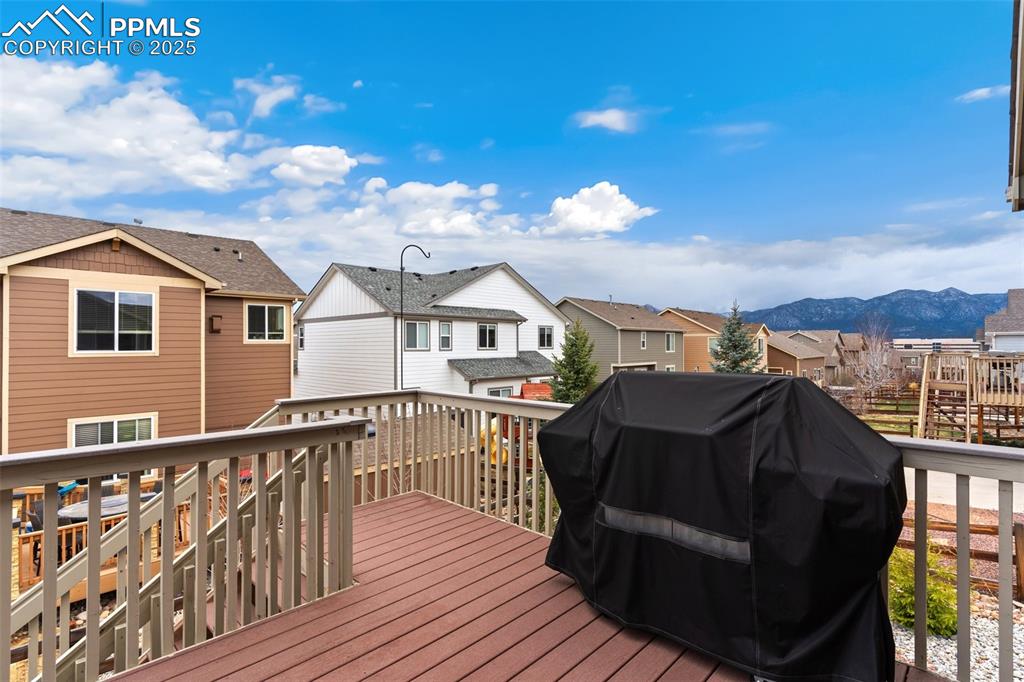 977 Salmon Pond Way Colorado Springs, CO 80921 - Photo 40 of 49 a view of a roof deck with wooden floor and city view
