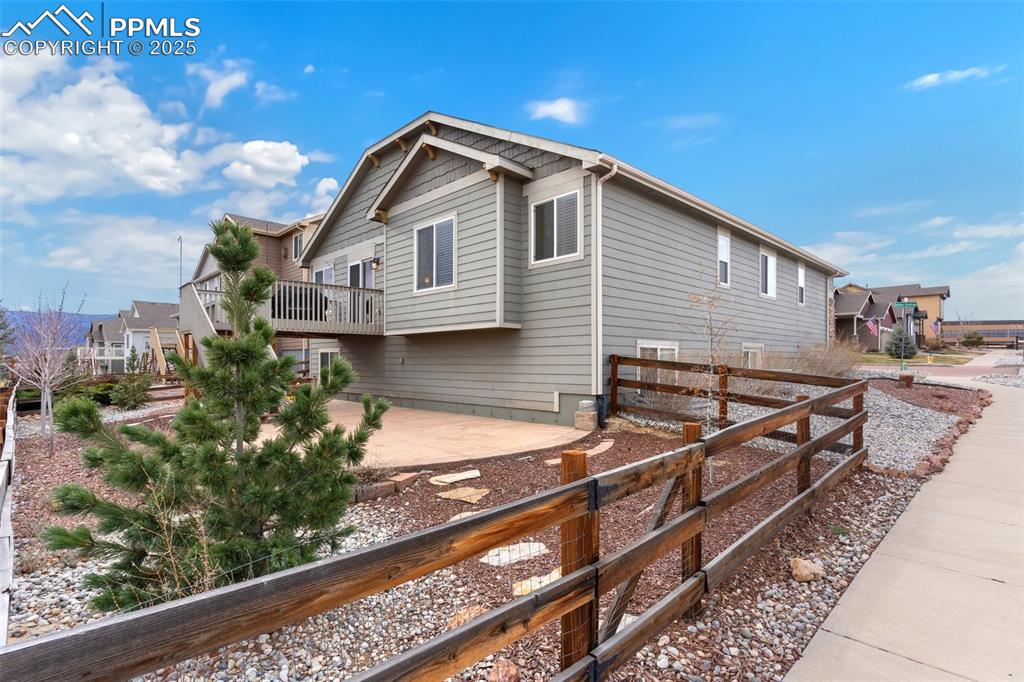 977 Salmon Pond Way Colorado Springs, CO 80921 - Photo 43 of 49 a front view of a house with garden