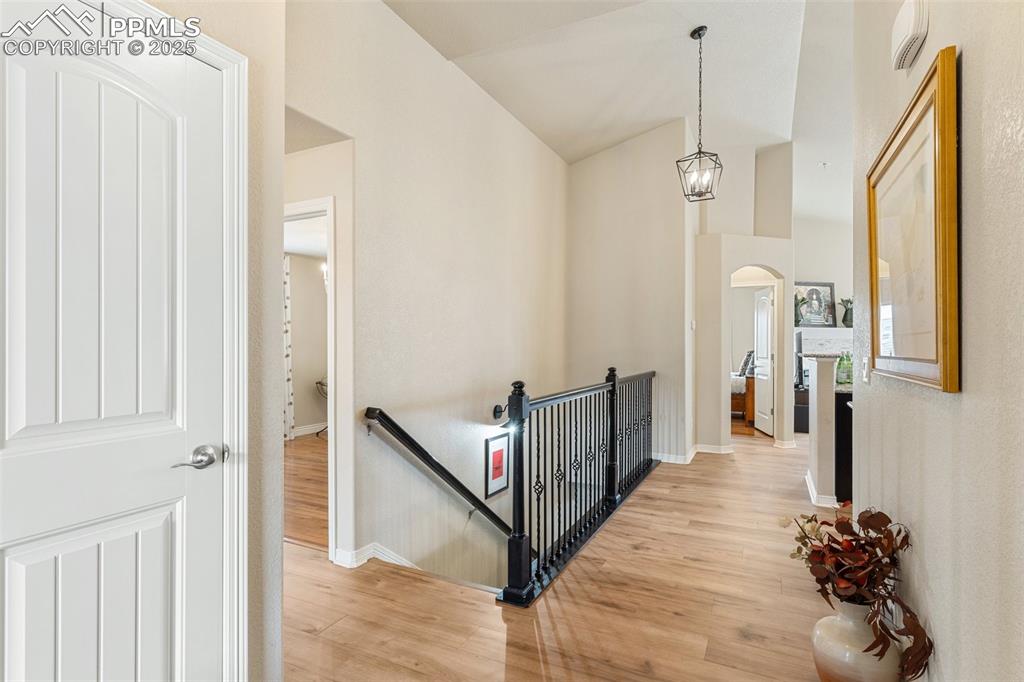 977 Salmon Pond Way Colorado Springs, CO 80921 - Photo 7 of 49 a view of a hallway with a chandelier