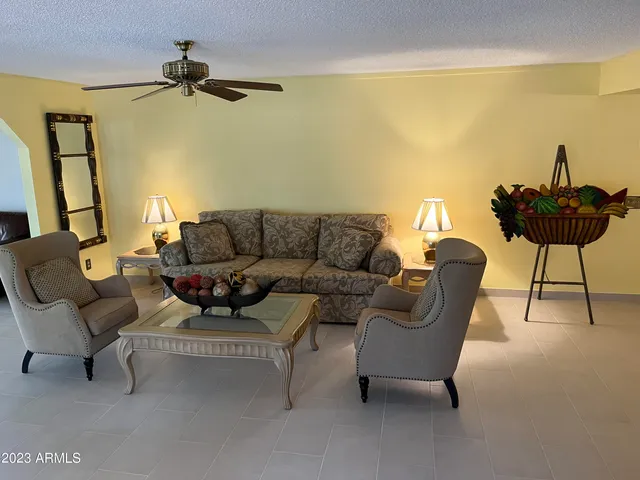 a living room with furniture and a window