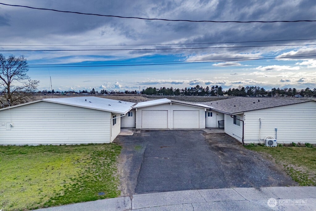 a view of a house with a street