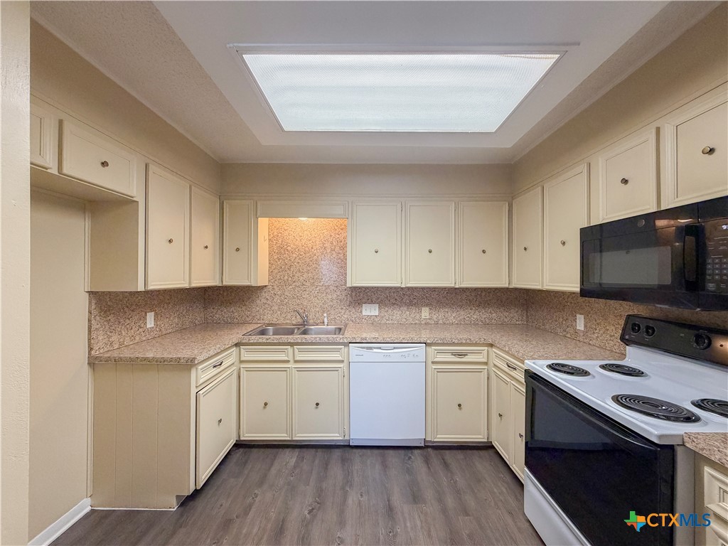 3806 Shallow Ford Road Temple, TX 76502 - Photo 6 of 20 a kitchen with a sink stove top oven and cabinets