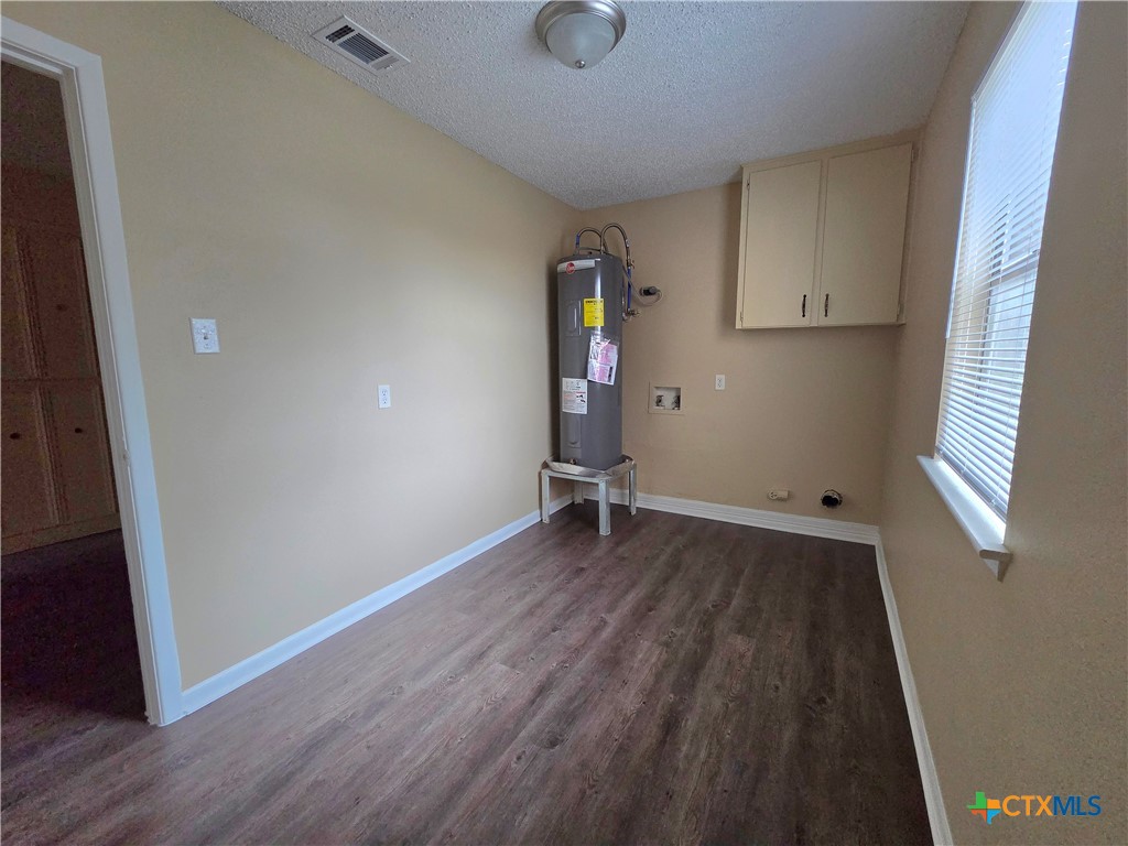 3806 Shallow Ford Road Temple, TX 76502 - Photo 7 of 20 an empty room with wooden floor and windows