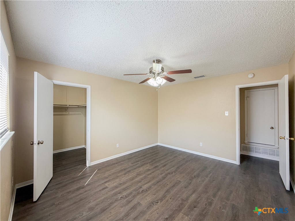 3806 Shallow Ford Road Temple, TX 76502 - Photo 10 of 20 an empty room with wooden floor and windows