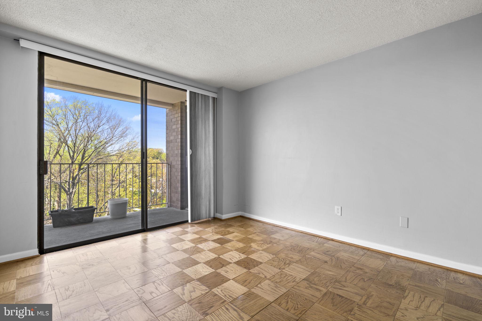 2100 Washington Avenue, Unit 9D Silver Spring, MD 20910 - Photo 11 of 29 a view of an empty room with a window