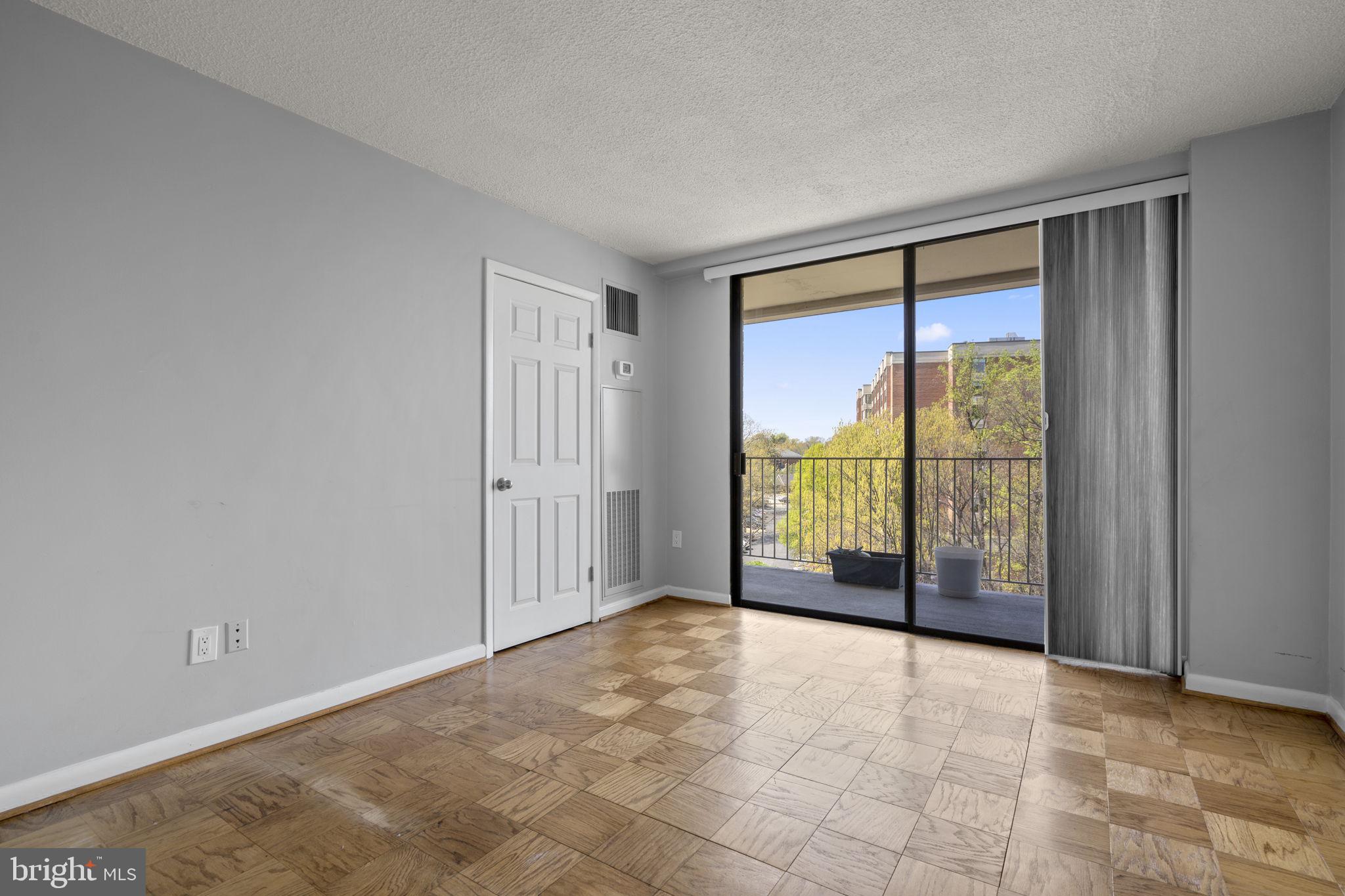 2100 Washington Avenue, Unit 9D Silver Spring, MD 20910 - Photo 13 of 29 a view of an empty room with glass door