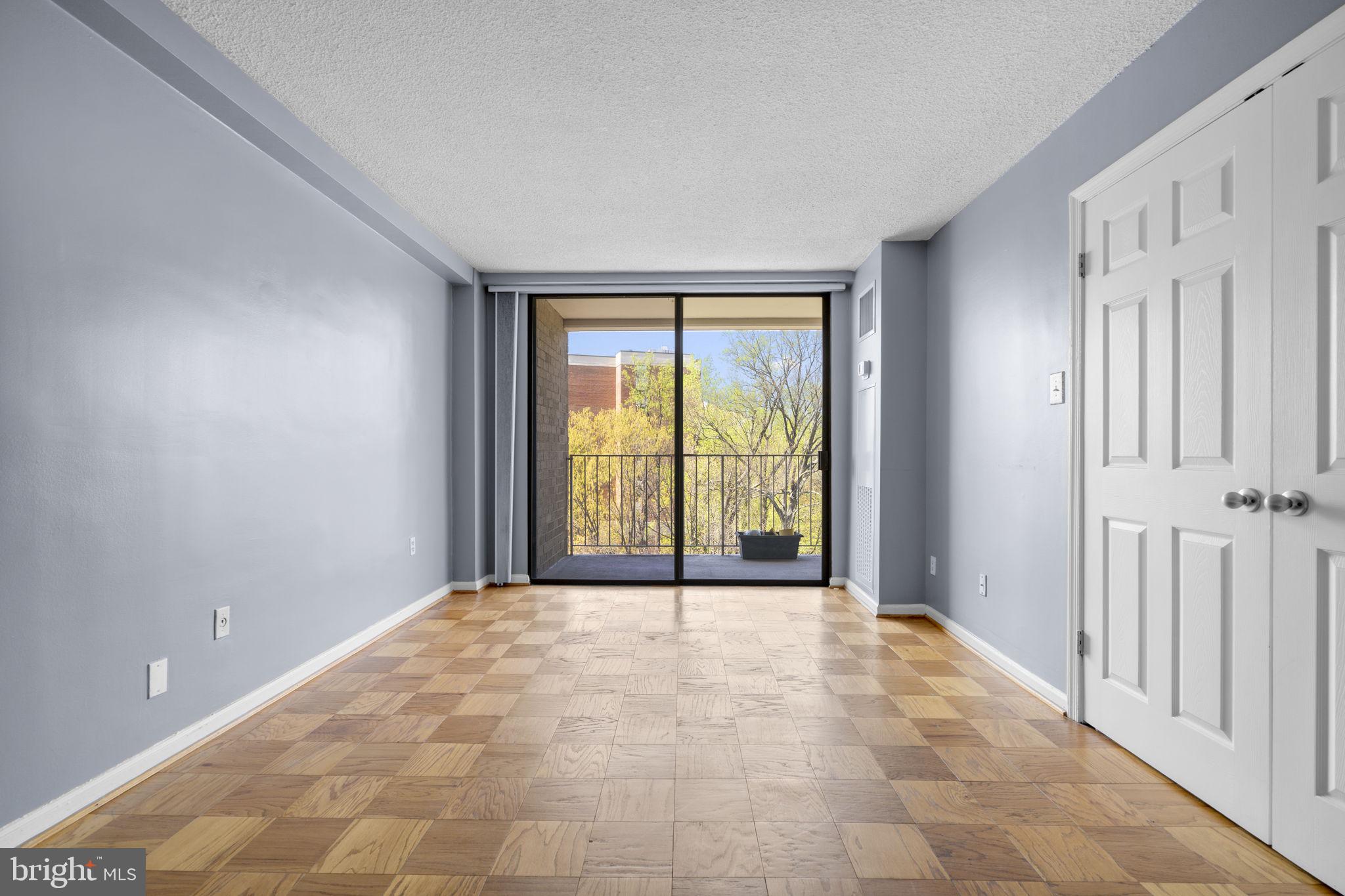 2100 Washington Avenue, Unit 9D Silver Spring, MD 20910 - Photo 6 of 29 a view of an empty room with a window