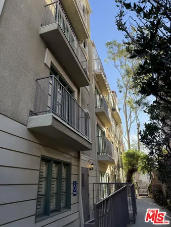 a view of a building with a yard