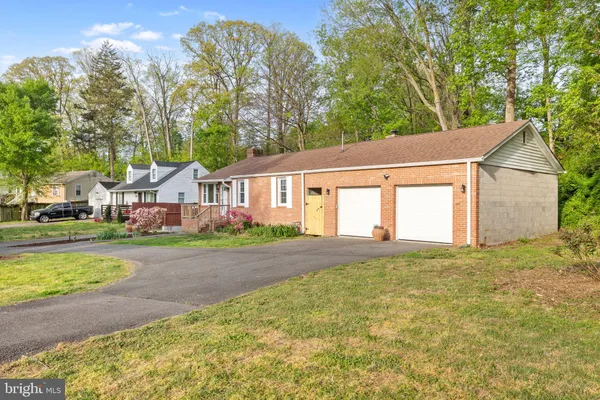 a kitchen with stainless steel appliances a refrigerator a sink a stove a microwave and island