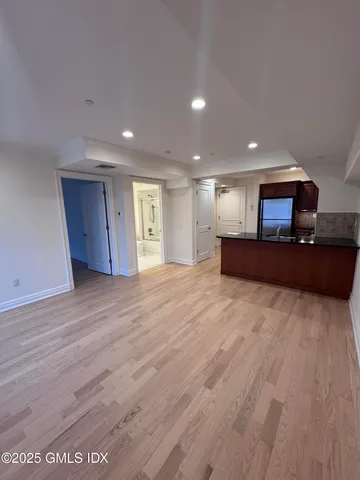 a view of kitchen and a wooden floor