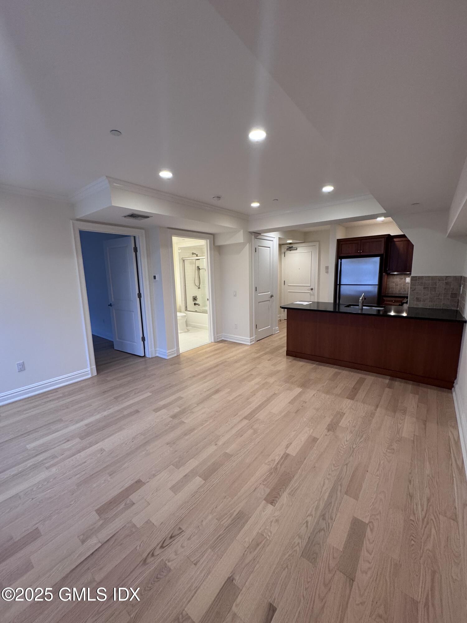 275 Greenwich Avenue, Unit 2B Greenwich, CT 06830 - Photo 5 of 8 a view of kitchen and a wooden floor