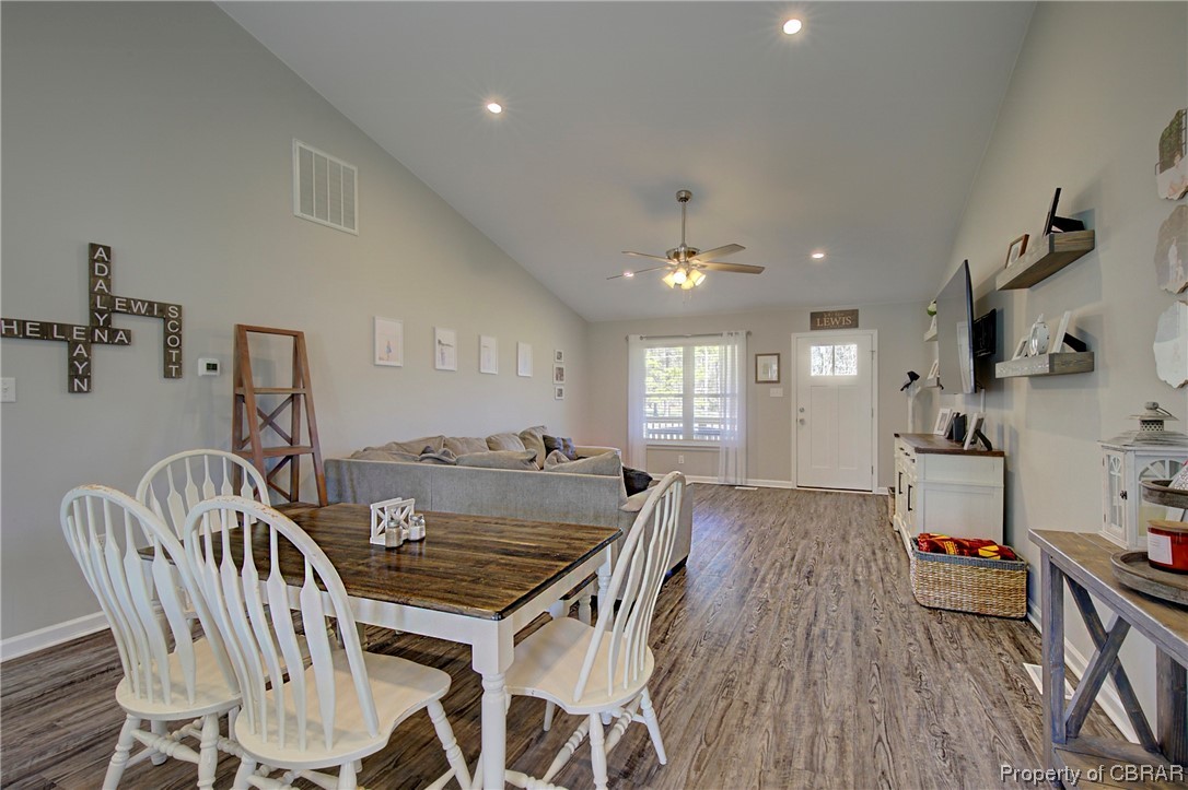 4944 Chestnut Fork Road Gloucester, VA 23061 - Photo 10 of 32 Dining space featuring dark hardwood / wood-style floors, ceiling fan, and lofted ceiling