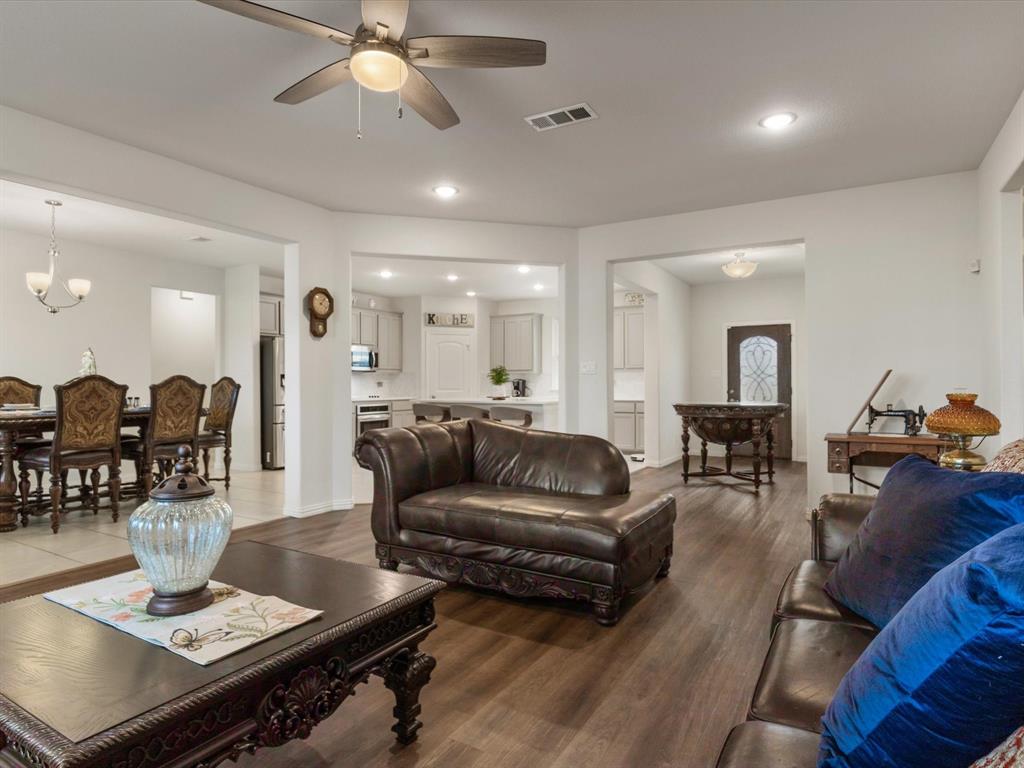 1009 Northern Oaks Court Springtown, TX 76082 - Photo 11 of 28 a living room with furniture and wooden floor